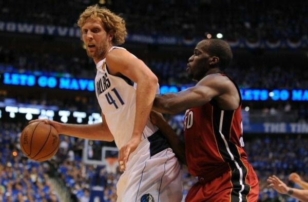 Joel Anthony (R) of the Miami Heat defends against Dirk Nowitzki (L) of the Dallas Mavericks during Game 4 of the NBA Finals on June 7, 2011 at the AmericanAirlines Center in Dallas, Texas.