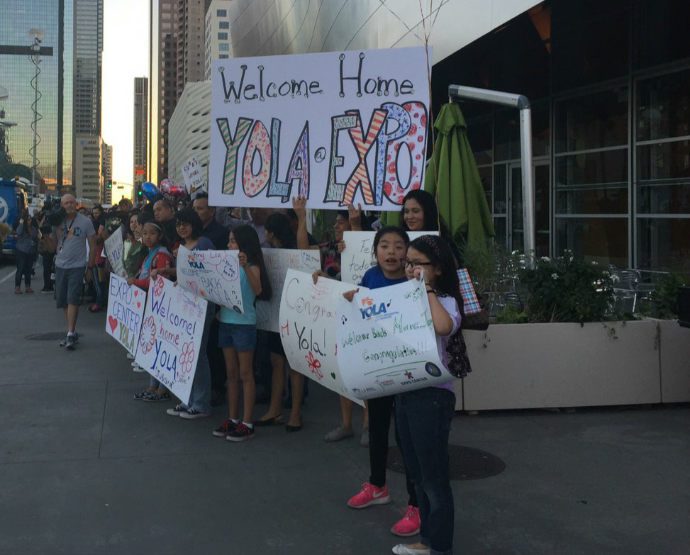 Families lined up outside of Disney Hall to welcome students back into town.