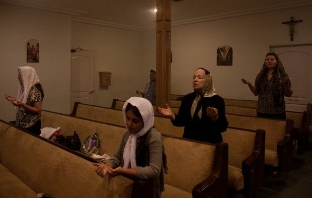 Egyptian Coptic Christians pray during a service at St. Mary of Egypt Coptic Orthodox Church in Newhall, Calif., October 2011