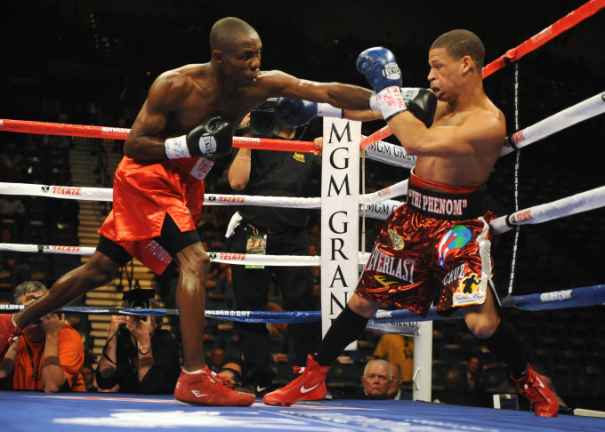 Cornelius Lock (L) of the US knocks down