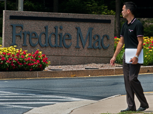 An unidentified man walks from the Fredd