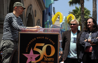 Musician Billy Corgan, left, speaks at the ceremony honoring Alex Lifeson and Geddy Lee of Rush who were honored with the 2,412th Star on the Hollywood Walk of Fame on June 25, 2010 in Hollywood, California. Hollywood celebrates the Walk of Fame's 50th Anniversary on July 25 with a day-long festival of open house tours.