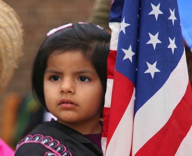 A child participates in a parade of flags, October 2010