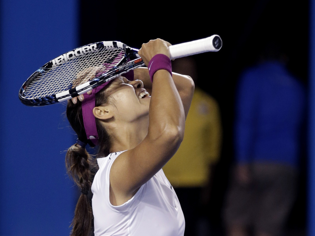 Li Na of China celebrates after defeating Dominika Cibulkova of Slovakia during their women's singles final at the Australian Open tennis championship in Melbourne, Australia, on Saturday.