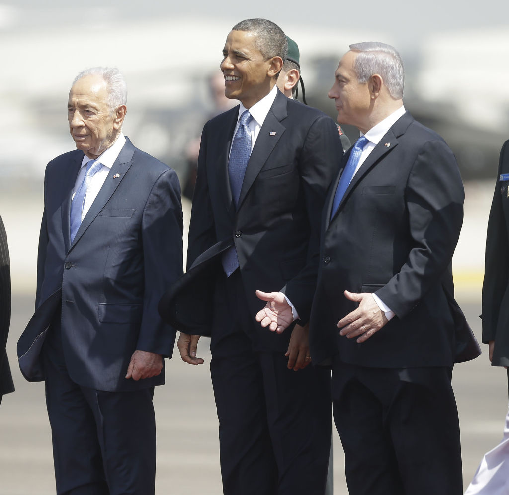 President Barack Obama is greeted by Israeli President Shimon Peres, left, and Israeli Prime Minister Benjamin Netanyahu upon his arrival ceremony at Ben Gurion International Airport in Tel Aviv, Israel, on Wednesday.