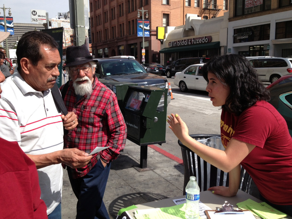 Charlene Gomez of the Coalition for Humane Immigrant Rights of Los Angeles asks passers-by on Broadway in downtown L.A. if they're willing to leave messages for a member of Congress during an immigration "call-a-thon" on Thursday, Feb. 20. It's one example of more aggressive tactics that some immigrant advocates have promised in hopes of pressuring lawmakers to vote on immigration reform.
