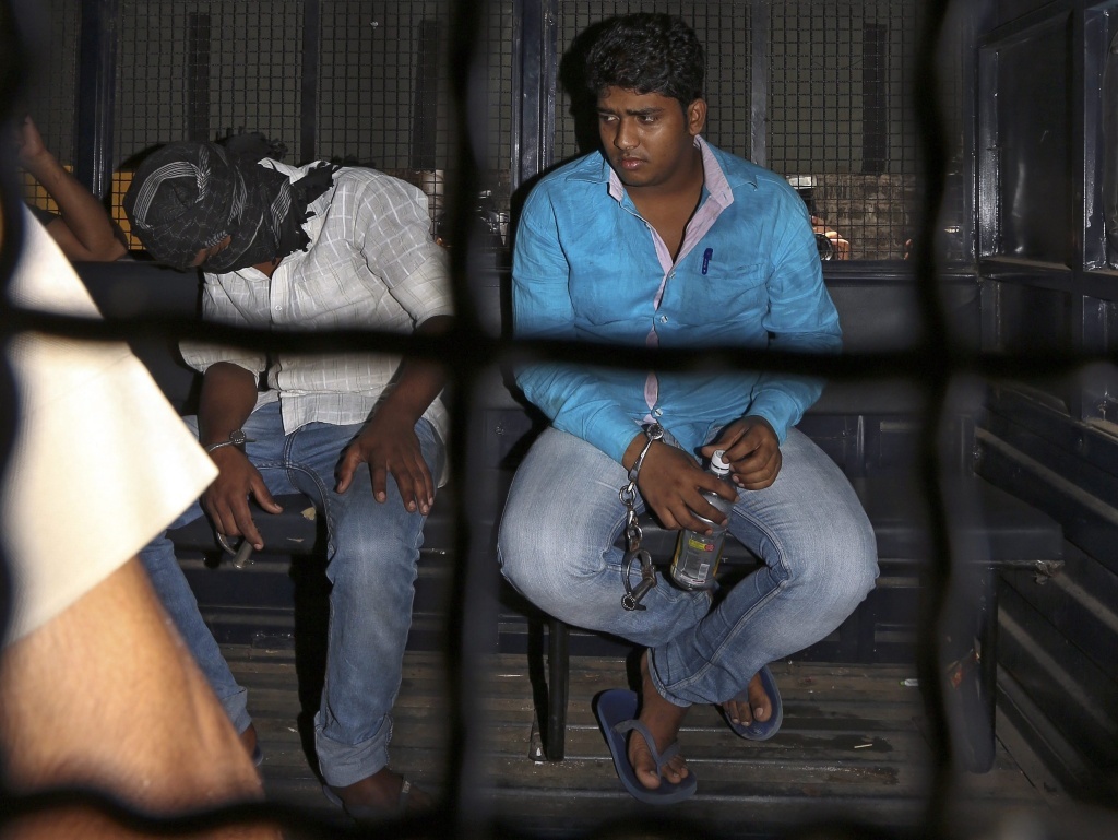 Mohammad Qasim Shaikh (right), and another accused of Shakti mill gang rape case, escorted by Mumbai Police as they are taken to a court session last month in Mumbai.