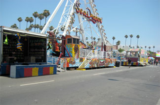 The carnival rides sit idle shortly after the event's opening.