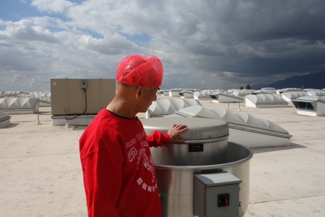 David Tran with an air filter atop his Sriracha chili sauce factory.