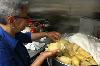 Patricia Zarate, manager of Homegirl Cafe, readies a batch of tamales. The L.A. restaurant is set to sell artisan tamales at a new LAX restaurant in a few months.