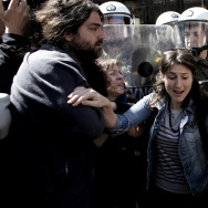 Protestors scuffle with riot police duri