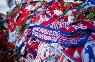 A Lokomotiv scarf is placed amongst flowers and candles at the 'Arena 2000' on Sept. 8 in Yaroslavl, Russia. Ice hockey fans all over the world are mourning after most of the Lokomotiv Yaroslavl ice hockey team were killed in a plane crash.