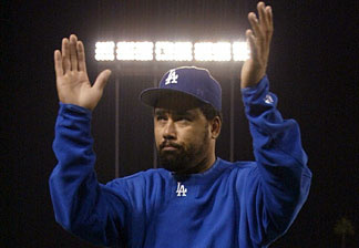 Pitcher Jose Lima #27 of the Los Angeles Dodgers waves to the crowd as he walks off the field after the National League Division Series Game Four loss 6-2 to St. Louis Cardinals on October 10, 2004 at Dodger Stadium.