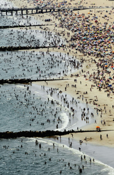 New Yorkers Seek Relief From Summer Heat At The Beach
