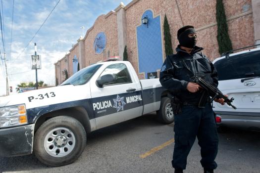 A member of the local police guards one