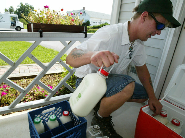 Driver Rick Galloway of South Mountain Creamery delivers milk in Liberty Town, Md., in 2004. Today the company has 8,500 home delivery accounts in five states.