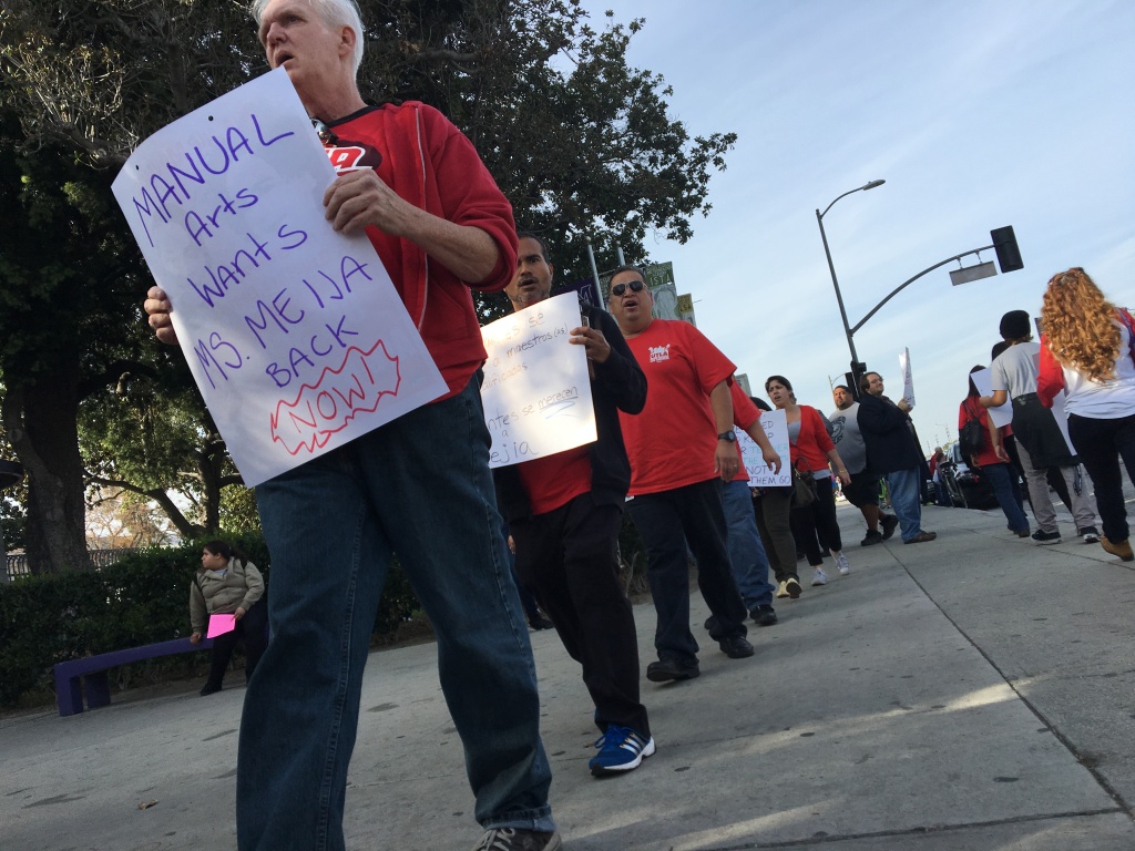 Members of the United Teachers Los Angeles union march outside Manual Arts High School in South L.A. calling for the reinstatement of teacher Roshni Mejia, who co-chaired the school's union chapter.