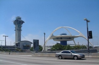 A car drives to the LAX departure terminal.
