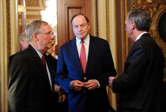 US Senate Minority Leader Mitch McConnell (L), R-KY, talks with Senator Richard Shelby (C), R-AL, and Senator Jud Gregg (R), R-NH, as they leave the closed door meeting of the Senate Republican Caucus on April 28, 2010 on Capitol Hill in Washington, DC.