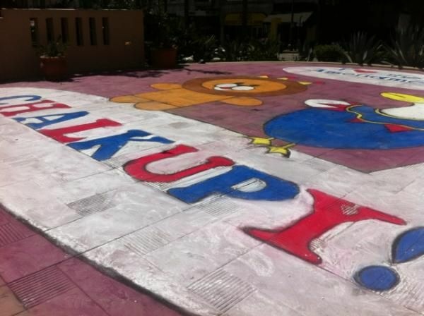 Occupiers from Oakland drew a chalk mural Thursday morning, which remains on the Northeast corner of Pershing Square.
