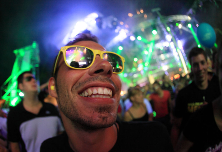 Ravers dance at the "Nature One" electro