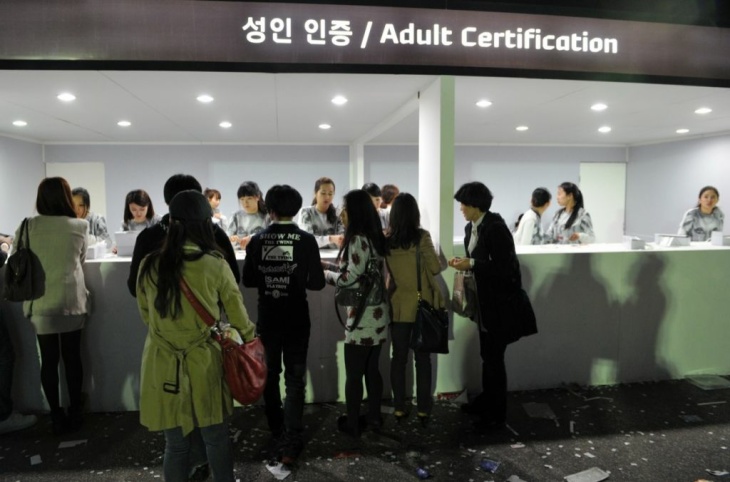 South Koreans present proof of age docum