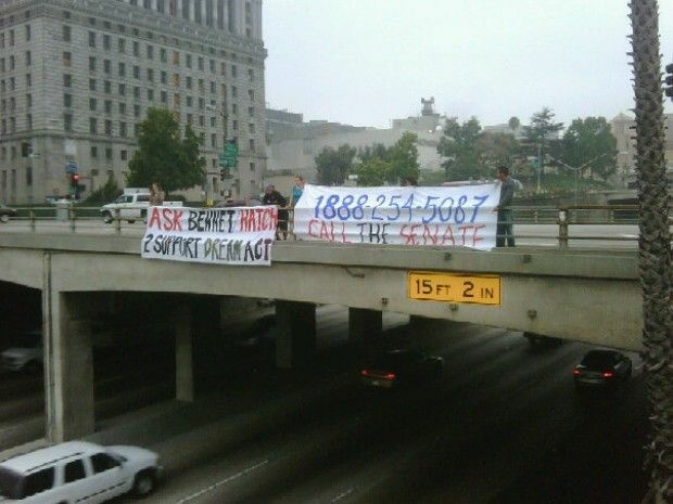 DREAM Act supporters hang a banner over the 101 Freeway downtown before the Senate vote last Tuesday, September 21, 2010