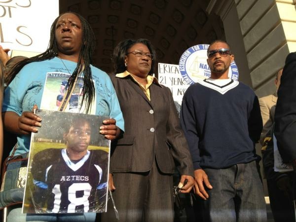The family of Kendrec McDade and attorney Caree Harper at a rally at Pasadena City Hall.