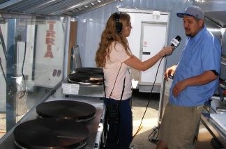 KPCC's Bridget Read with Juan Gomez, co-owner of West Coast Catering Trucks, in an almost-complete catering truck built for crepe-makers.