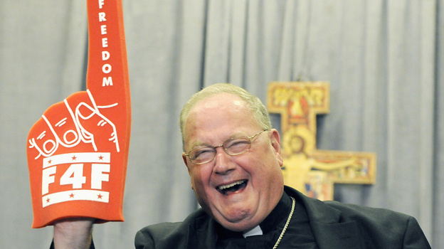 Cardinal Timothy Dolan of New York brandishes a foam finger promoting the "Fortnight for Freedom" campaign last week.