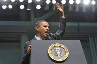 US President Barack Obama waves as as he finishes his address to military personnel at the Naval Air Technical Training Center of the Pensacola Naval Air Station June 15, 2010 in Pensacola, Florida.