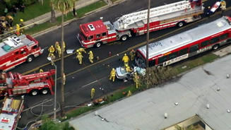 Firefighters at the scene of a head-on accident between a BMW and an LA County bus in Hollywood Tuesday morning.