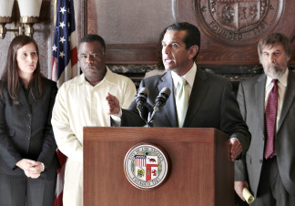 Los Angeles Mayor Antonio Villaraigosa at podium, announces the city and The Los Angeles Unified School District board will move ahead with reform efforts with or without the support from the Teachers' Union on Thursday, Oct. 7, 2010, during a news conference at the City Hall in Los Angeles. From left: teachers at Gompers school: Sarah Talley and Kenneth Aubrey. Mark Rosenbaum, Chief Council ACLU, far right.