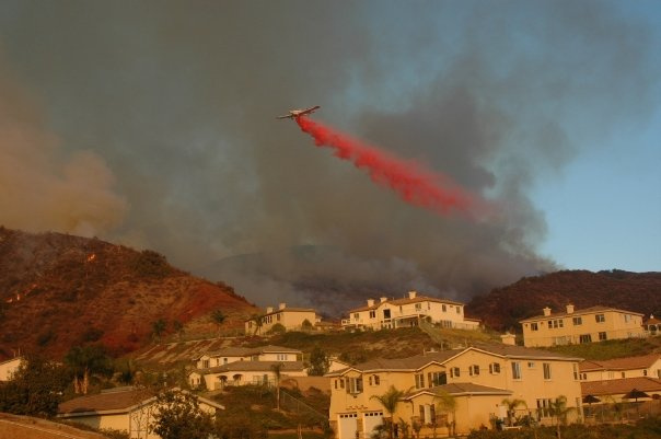 Firefighters drop retardant during the Santiago Fire in Orange County in 2007. The wind-driven wildfire destroyed a dozen homes.