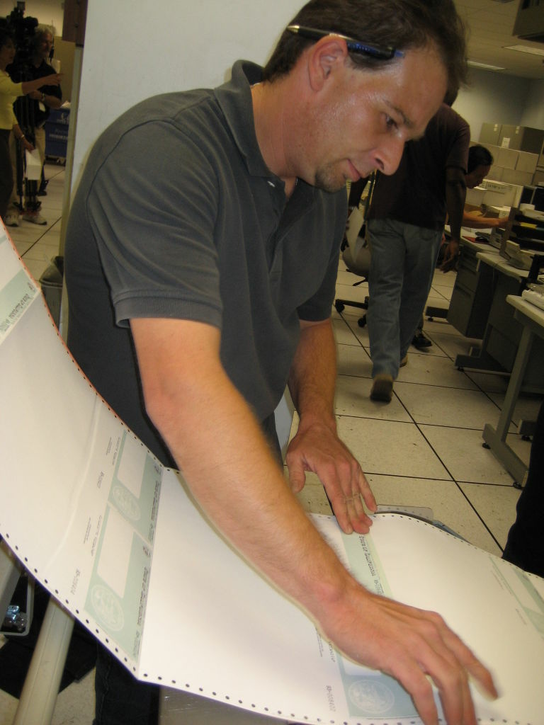 State Controller worker Shawn Taylor printing IOUs