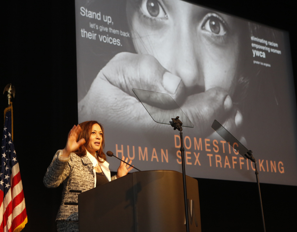 In this April 25, 2014 file picture, California Attorney General Kamala Harris, who as a prosecutor once specialized in child sexual assault cases, addresses the Domestic Human Trafficking symposium in Los Angeles. Trafficking, forced labor and modern slavery are big business generating profits estimated at $150 billion a year, the U.N. labor agency said in May. On Monday, June 23, FBI officials announced the results of last week's national roundup as they try to draw attention to what they describe as a pervasive problem.