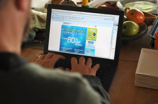 A man looks at an advertisement on his laptop computer in Los Angeles on November 30, 2009.