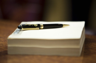 California Governor Arnold Schwarzenegger signs the state's budget solution in Sacramento, California.