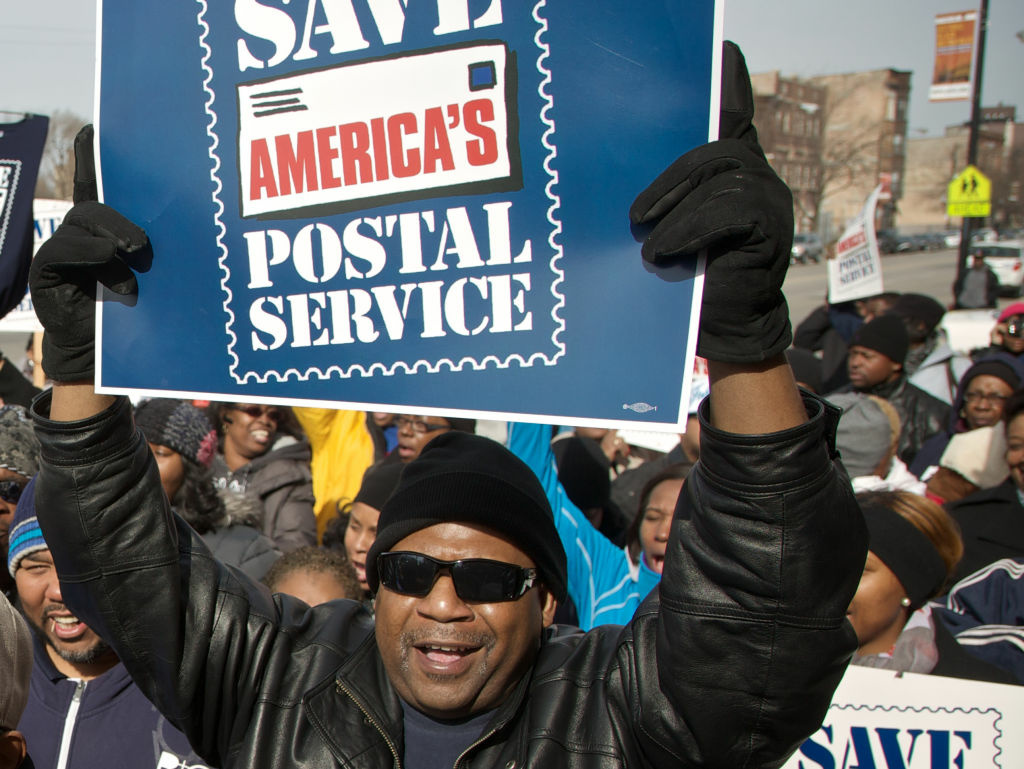 A Chicago postal worker protests in support of Saturday mail delivery in February.