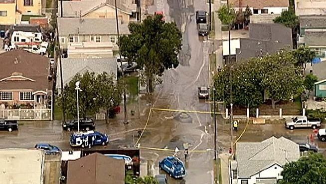 A water main break flooded the intersection at W. 59th Street and S. Hoover Street on Friday, May 25, 2012.