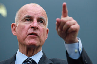 File photo: California Attorney General and Democratic candidate for governor Jerry Brown gestures during a news conference August 31, 2010 in Oakland, California. Attorney general Brown announced that law enforcement officers had arrested key members of the Nuestra Familia gang who had orchestrated crimes from inside prison using cell phones.