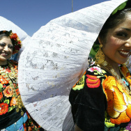 Two girls wearing Oaxacan traditional co