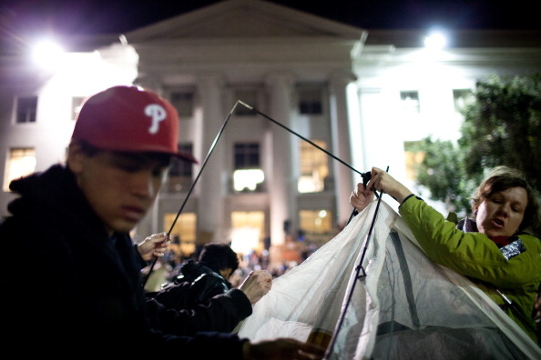 University of California, Berkeley students set up tents after a general assembly voted to again occupy campus as part of an 'open university' strike in solidarity with the Occupy Wall Street movement on November 15, 2011 in Berkeley, California. Teach-outs, workshops, public readings, and marches will culminate in an attempt to re-establish an Occupy Cal encampment that was shut down by police last week.
