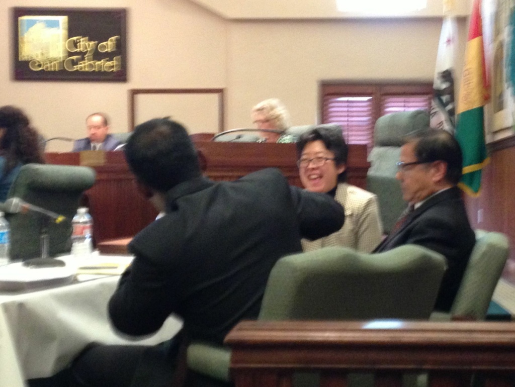 Attorneys Deanna Kitamura, center, and Nilay Vora, left, celebrate on hearing that Councilman-elect Chin-Ho Liao, right, will be permitted to take his seat on the San Gabriel City Council.