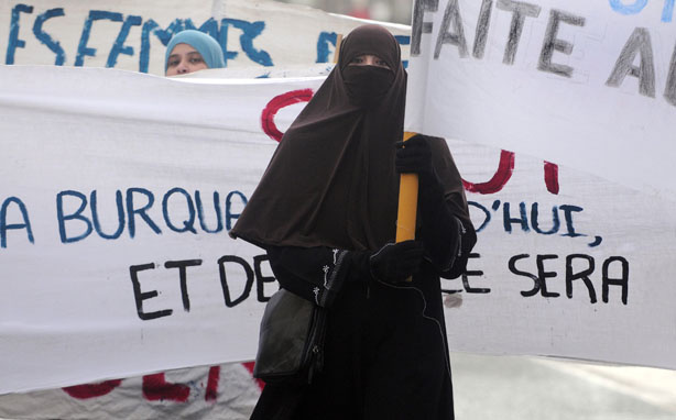 A woman wearing a 'Niqab' veil participates in a protest on February 6, 2010 in Tours, central France, after a panel of French lawmakers recommended a ban on the face-covering veil in all schools, hospitals, public transport and government offices. According to the interior ministry, only around 1,900 women wear the burqa in France, which is home to Europe's biggest Muslim minority.