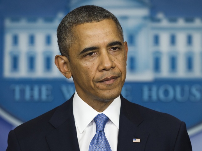 President Obama speaks with reporters at the White House on Monday about the threat of a government shutdown.