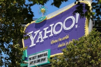 A Yahoo! billboard is visible through trees in San Francisco, California.