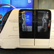 An engineer adjusts a driverless car dur