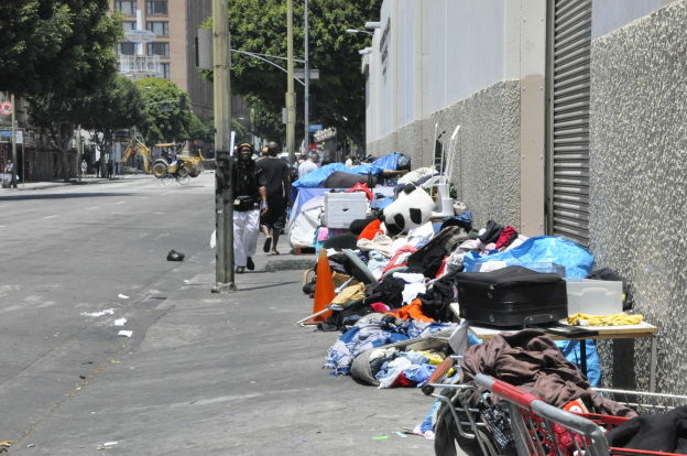 Two parks in the Skid Row area will remain open for another six months as the Los Angeles City Council moves around money to make up for the loss of redevelopment funds.