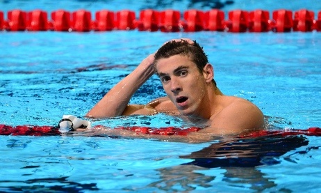 Michael Phelps reacts after winning the men's 200m Butterfly semifinal on day six of the 2012 U.S. Olympic Team Trials on Saturday, June 30, 2012.